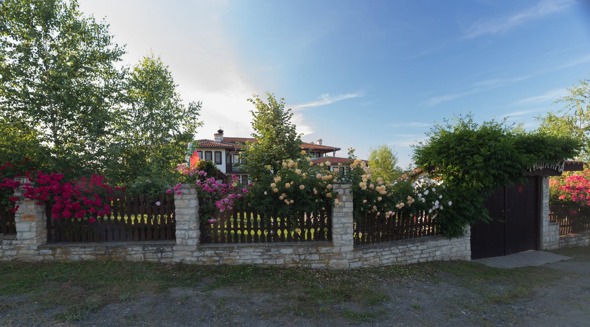 Flowering fence and entrance at Chiflika