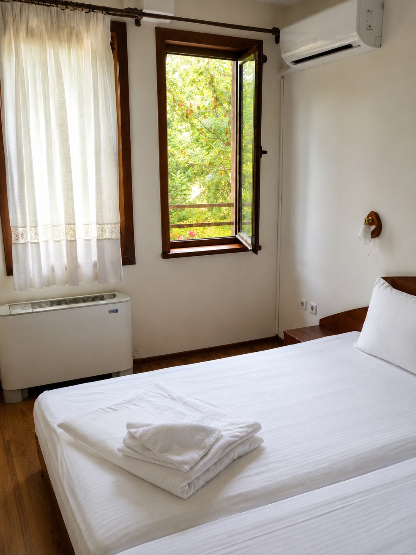Guest room window with garden greenery