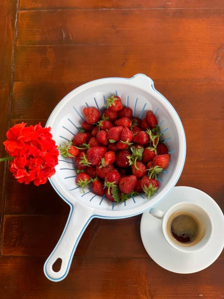 Strawberries and coffee on a wooden table